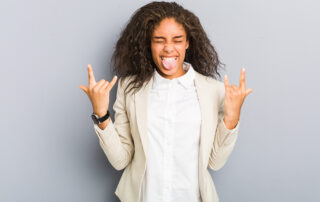 Black business woman with rock fingers